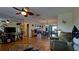 Spacious living area with tile floors, fan, and an open view to dining area at 1320 Bottlebrush Dr, Bradenton, FL 34208