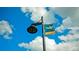 Street sign showing the way to Old Main Street under a blue, cloudy sky at 1320 Bottlebrush Dr, Bradenton, FL 34208