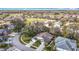 Aerial view of homes nestled within a lush, green community with mature trees at 13439 Norman Cir, Hudson, FL 34669