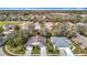 Beautiful aerial view of single-Gathering homes in a well-manicured community with a golf course at 13439 Norman Cir, Hudson, FL 34669