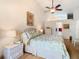 Serene bedroom featuring natural light, a comfortable bed, and neutral decor at 13439 Norman Cir, Hudson, FL 34669