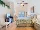 Inviting bedroom with a ceiling fan and a view of the outdoors at 13439 Norman Cir, Hudson, FL 34669