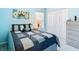 Comfortable bedroom with ample closet space and soothing blue walls at 13439 Norman Cir, Hudson, FL 34669