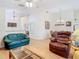 Spacious living area with hardwood floors, neutral walls, and comfortable furnishings at 13439 Norman Cir, Hudson, FL 34669
