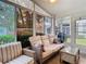 Comfortable sunroom with outdoor views, ideal for relaxing or entertaining guests at 13439 Norman Cir, Hudson, FL 34669