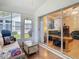 Relaxing sunroom with sliding glass doors leading to the living area at 13439 Norman Cir, Hudson, FL 34669