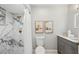 Nicely appointed bathroom featuring a marble shower, modern vanity, and neutral decor at 14333 Lake Magdalene Blvd, Tampa, FL 33618