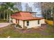 Well-maintained home featuring a unique roof, stone accents, and a spacious backyard at 14333 Lake Magdalene Blvd, Tampa, FL 33618