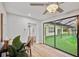 Living room showcases hardwood floors, large windows with a view of the outdoor area, and neutral colors at 14333 Lake Magdalene Blvd, Tampa, FL 33618