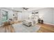 Bright main bedroom features a sliding barn door, ceiling fan, and neutral decor at 14333 Lake Magdalene Blvd, Tampa, FL 33618