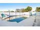 Inviting in-ground pool with surrounding patio space, complemented by comfortable seating and a privacy fence at 1485 54Th Ne Ave, St Petersburg, FL 33703