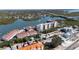 Aerial view of waterfront condos with boat docks, community pool, and easy access to the ocean at 19111 Vista Bay Dr # 401, Indian Shores, FL 33785