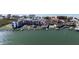 Waterfront condo complex with boat docks, community pool, and beautiful landscaping situated near open ocean at 19111 Vista Bay Dr # 401, Indian Shores, FL 33785