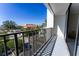 Tiled balcony with an iron railing offering stunning views of the neighborhood at 19111 Vista Bay Dr # 401, Indian Shores, FL 33785