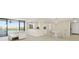 Open living room with a breakfast bar, dining area, and a view of the water at 19111 Vista Bay Dr # 401, Indian Shores, FL 33785