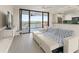The living room area features a large sliding glass door to the balcony with water views at 19111 Vista Bay Dr # 401, Indian Shores, FL 33785
