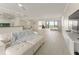 Bright living room featuring neutral color palette and large windows with gorgeous water views at 19111 Vista Bay Dr # 401, Indian Shores, FL 33785