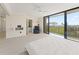 Open main bedroom offers a sliding glass door for balcony access and an ensuite bathroom at 19111 Vista Bay Dr # 401, Indian Shores, FL 33785