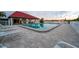 Relaxing pool area with seating, a covered pavilion, and tranquil water views for residents and guests at 19111 Vista Bay Dr # 401, Indian Shores, FL 33785