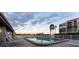 Inviting outdoor pool with lounge chairs and serene waterfront views, perfect for relaxation and recreation at 19111 Vista Bay Dr # 401, Indian Shores, FL 33785