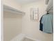 Walk-in closet with built-in shelves, hanging space, and neutral finishes at 19111 Vista Bay Dr # 401, Indian Shores, FL 33785