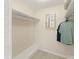 Ample storage abounds in this walk-in closet with shelves and hanging rods at 19111 Vista Bay Dr # 401, Indian Shores, FL 33785