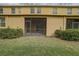 This is a backyard view of the enclosed lanais with grassy lawn and landscaping at 2007 Hawks View Dr, Ruskin, FL 33570