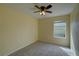 Bedroom with carpeting and one window for natural light at 2007 Hawks View Dr, Ruskin, FL 33570