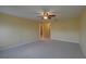 Bedroom with neutral carpet and easy access to the bathroom at 2007 Hawks View Dr, Ruskin, FL 33570