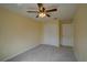 Bedroom features carpeted floor, closet and ceiling fan at 2007 Hawks View Dr, Ruskin, FL 33570