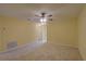 Spacious bedroom with neutral carpet and a ceiling fan for added comfort at 2007 Hawks View Dr, Ruskin, FL 33570