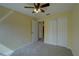 This is a bedroom featuring carpet flooring, ceiling fan and standard closet at 2007 Hawks View Dr, Ruskin, FL 33570