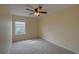 Carpeted bedroom with window offering natural light at 2007 Hawks View Dr, Ruskin, FL 33570