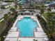 Aerial shot of sparkling community pool and sun deck with lounge chairs at 2007 Hawks View Dr, Ruskin, FL 33570