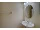 This is a half bath featuring a single sink with an oval mirror at 2007 Hawks View Dr, Ruskin, FL 33570