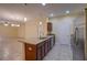 Open-concept kitchen with granite countertops, stainless steel appliances, and a seamless transition to the living area at 2007 Hawks View Dr, Ruskin, FL 33570