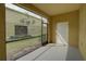 This is an enclosed lanai with a gray floor and views of the backyard at 2007 Hawks View Dr, Ruskin, FL 33570