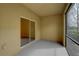 This is an enclosed lanai featuring tile flooring and sliding glass doors to the interior at 2007 Hawks View Dr, Ruskin, FL 33570
