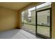 This is an enclosed lanai with a gray floor and views of the backyard at 2007 Hawks View Dr, Ruskin, FL 33570