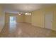 Bright living room with tile floors, a ceiling fan, and sliding glass doors that lead to an outdoor space at 2007 Hawks View Dr, Ruskin, FL 33570