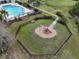 Aerial view of community playground with a slide next to the community pool at 2007 Hawks View Dr, Ruskin, FL 33570