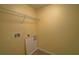 This is a utility room with tile flooring and a shelf at 2007 Hawks View Dr, Ruskin, FL 33570