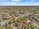 Bird's eye view showing a neighborhood with tree-lined streets, varied rooftops, and well-maintained landscaping on a sunny day at 2207 Boxwood Way, Brandon, FL 33511
