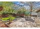 This cozy backyard has a wood deck with an outdoor table set on top of it, perfect for enjoying the weather at 2207 Boxwood Way, Brandon, FL 33511