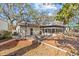 Spacious backyard features an outdoor deck, brick patio, and a basketball hoop at 2207 Boxwood Way, Brandon, FL 33511