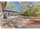 Enjoy the backyard patio with an outdoor grill, dining set, and basketball hoop for Gathering fun and entertainment at 2207 Boxwood Way, Brandon, FL 33511