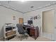 Functional home office featuring a practical layout and ample workspace with bright walls and nautical-themed decor at 2207 Boxwood Way, Brandon, FL 33511