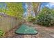 Backyard putting green offering a recreational amenity amidst the privacy of a fenced yard and natural surroundings at 2207 Boxwood Way, Brandon, FL 33511