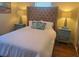 Cozy bedroom featuring a king bed, coastal pillows, side tables, and stylish lamps at 2235 20Th St S, St Petersburg, FL 33712