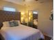 Bright bedroom boasting a king bed, coastal pillows, mirrored closet doors, and tasteful decor at 2235 20Th St S, St Petersburg, FL 33712